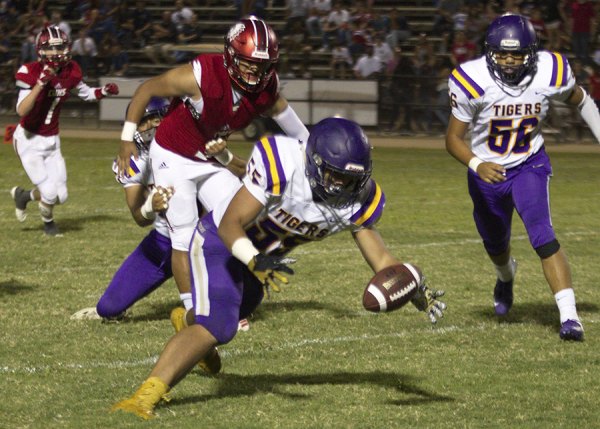 Tigers end losing streak as they host Tulare Western Friday in home opener Tiger linebacker Sione Hanna recovers a Chowchilla fumble in Friday's 26-16 victory over Chowchilla. Lemoore will host Tulare Western on Friday night in its home opener.